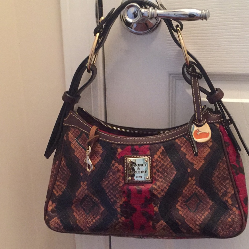 Small multicolor used Dooney & Bourke handbag.